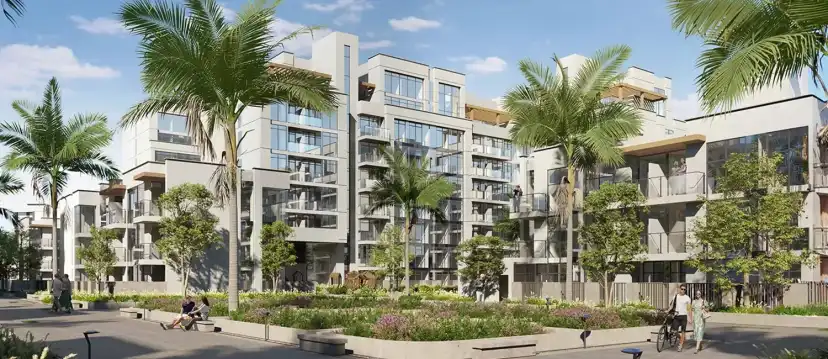 Courtyard garden between apartment buildings with palm trees