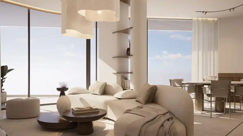 Three bedroom living and dining room with floor to ceiling glazing and cream furnishings