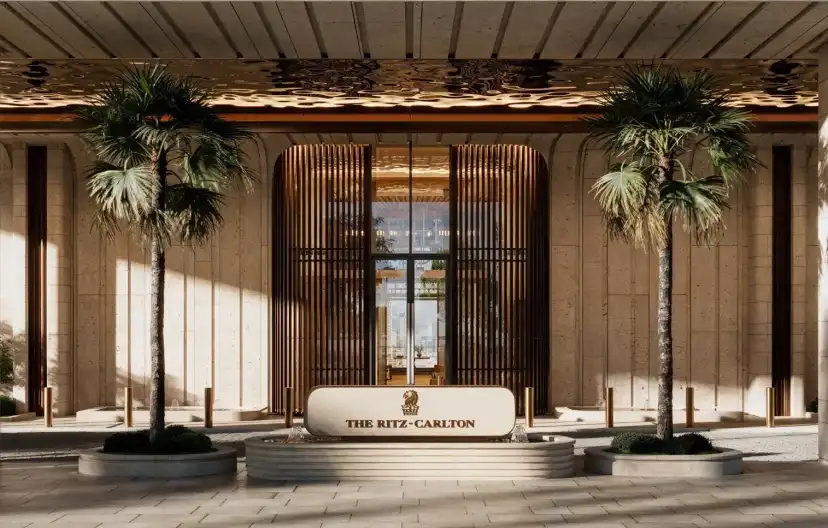 Entrance of The Ritz-Carlton Residences framed by palms and timber screens