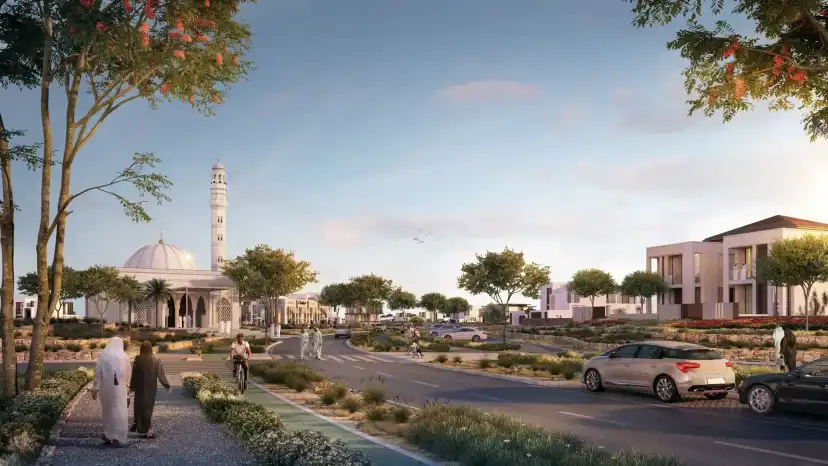 Village road with a mosque and white villas in the evening light