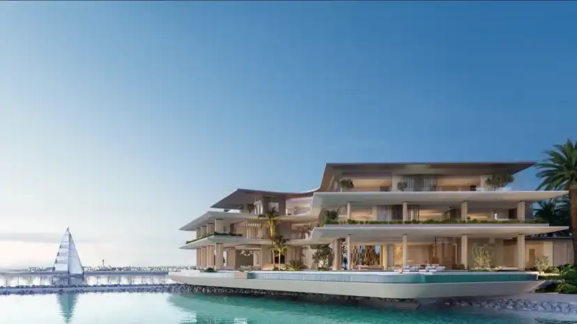 Mansion with terraces stepping to the sea and a jetty with a sailing boat