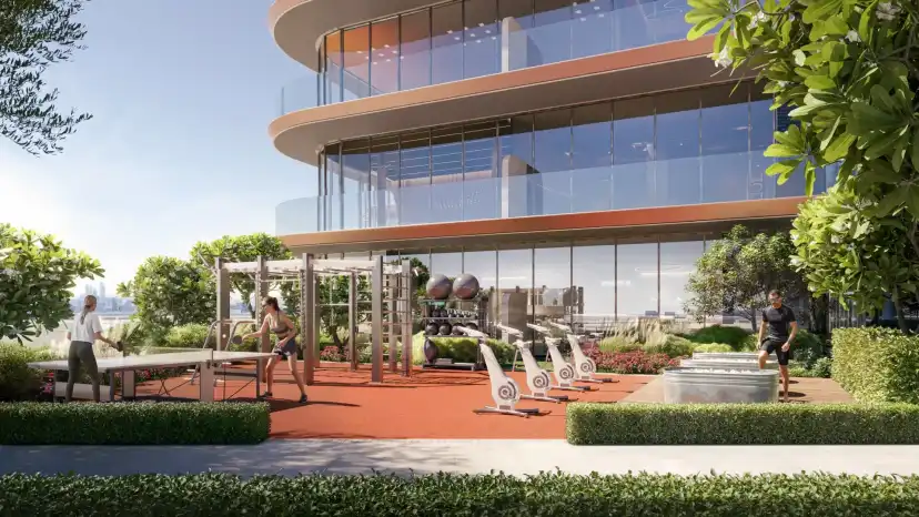 Landscaped plaza with an outdoor fitness area in front of the glazed lower floors