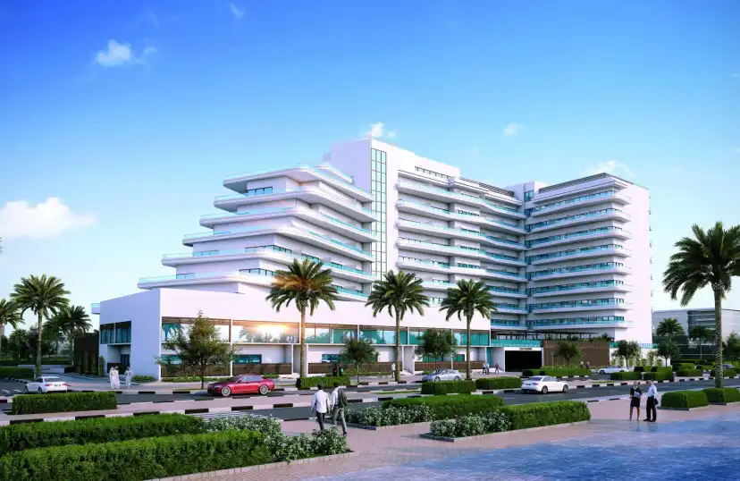 Mayyas at The Bay seen from the street with palm trees and landscaping