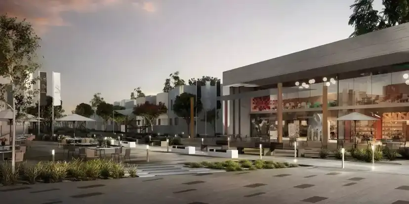 Al Ghadeer 2 community plaza with outdoor café seating