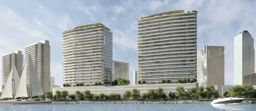 The two Marlin 1 towers seen from the water with a speedboat in front