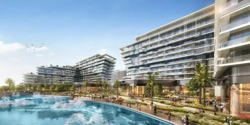 The Source buildings beside landscaped water and a residential pool