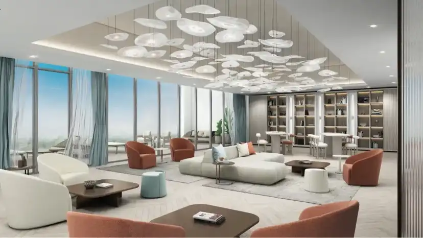 Residents lounge with pendant lights, seating and book shelves