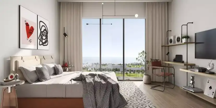Manarat Living bedroom with a full-height window and built-in storage