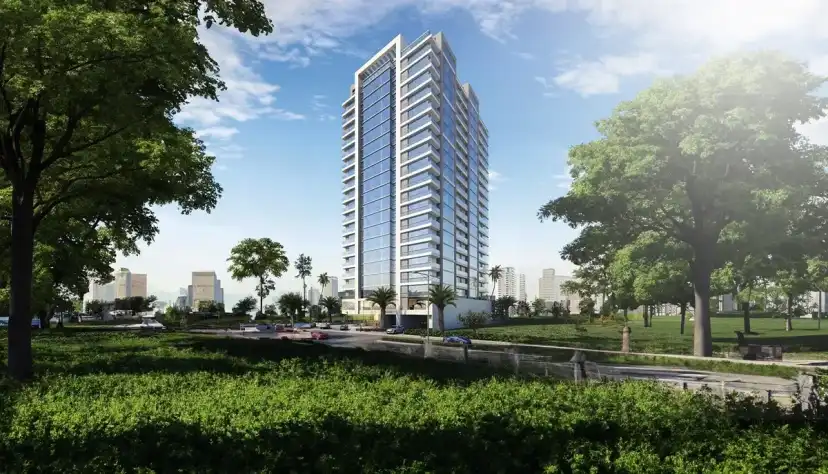 AK Tower seen across a green park