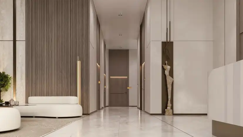 Reeman Residences lobby with warm stone finishes and seating