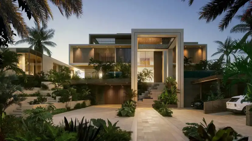 Mansion entrance framed by palms and stone steps at dusk