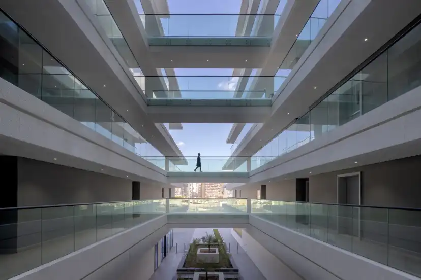 View down the glazed atrium between the terraced floors