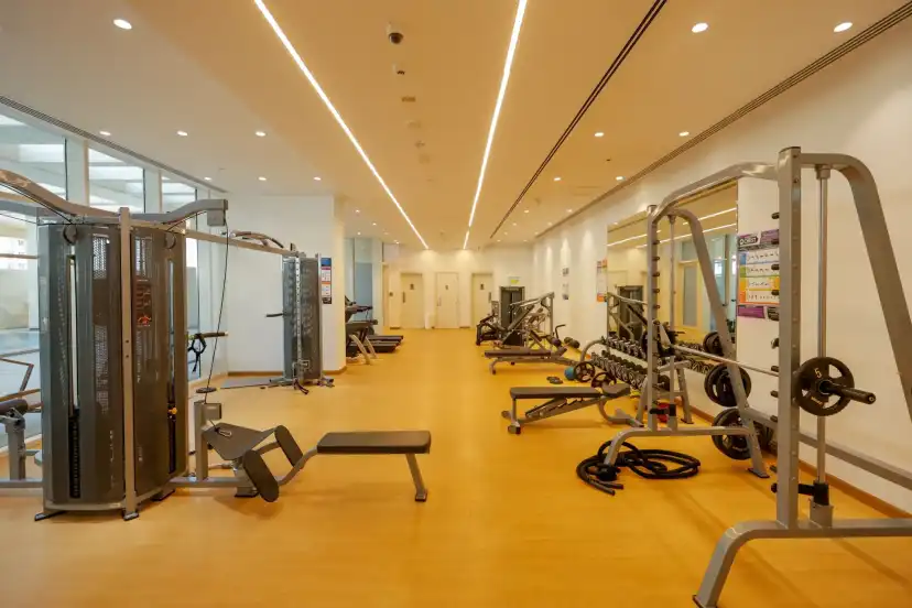 Gym with weight machines and a timber floor