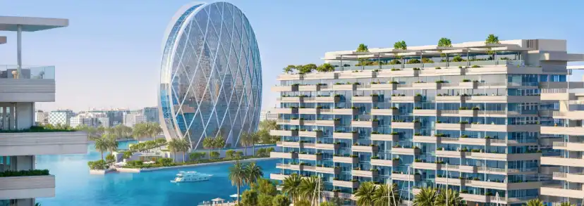 Panorama of two terraced residential buildings and the glass sphere over the marina