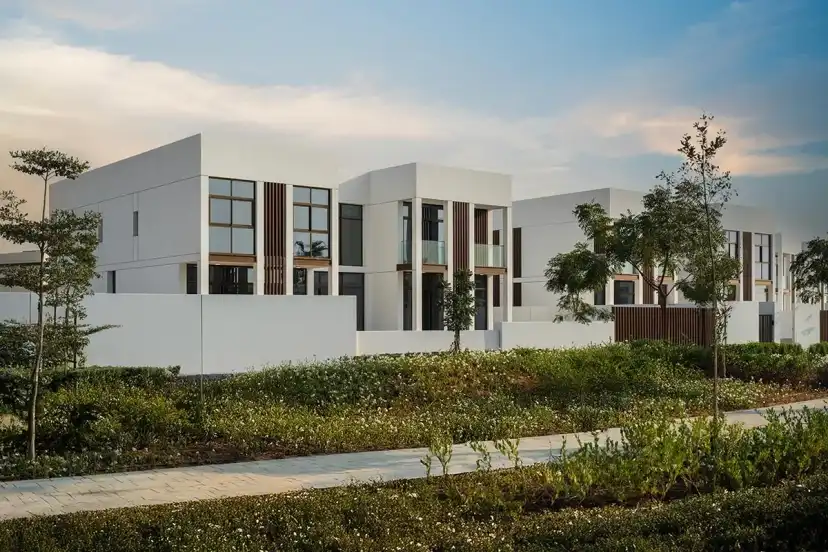 Two-storey villa with timber accents beside a walking path