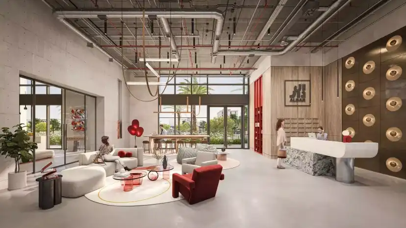 Manarat Living II shared lobby with red seating and exposed ceiling details